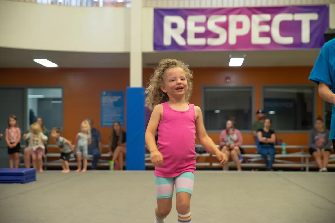 Girl Smiling At Youth Gymnastics