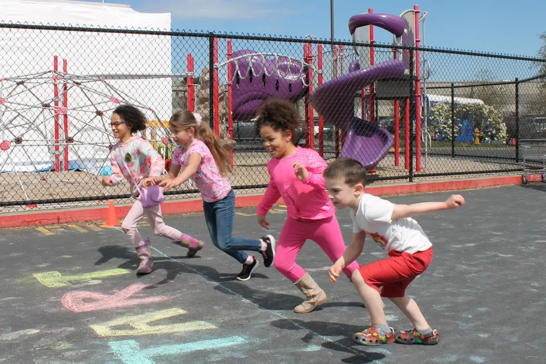 Action shot of Healthy Kids Day participants starting to run the fun run at the YMCA
