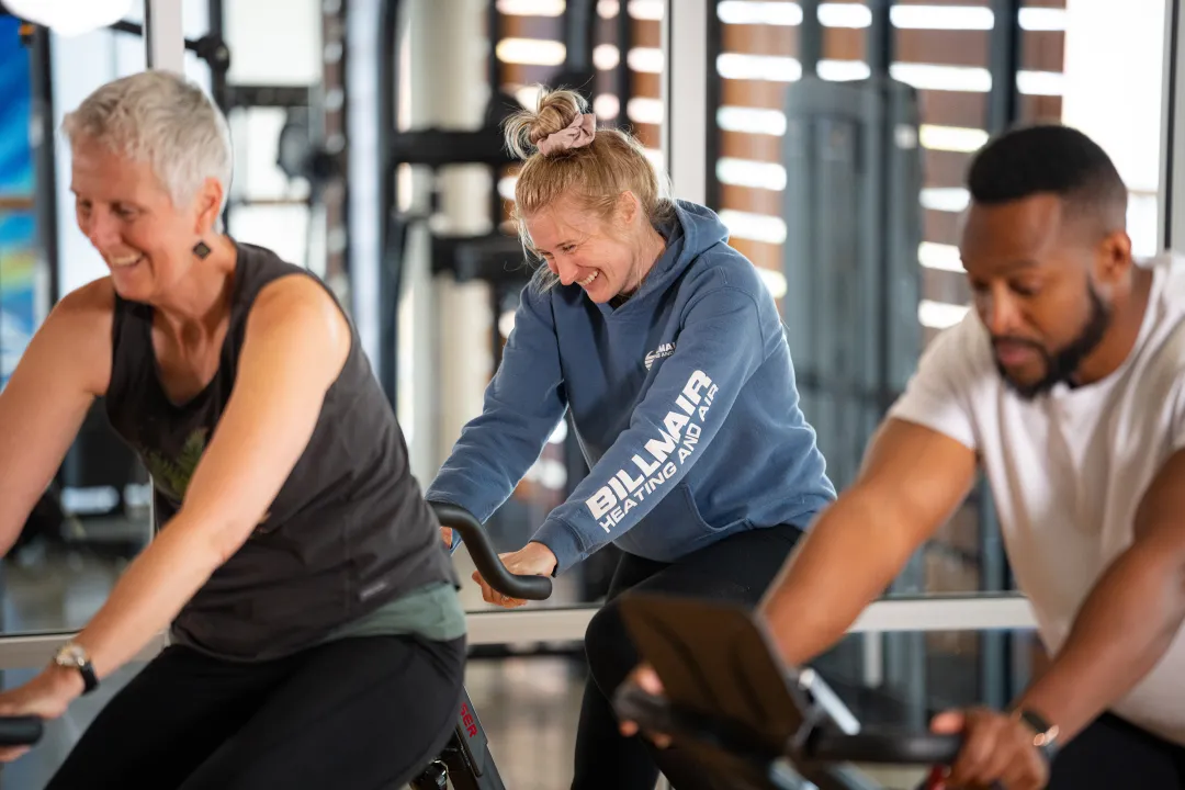 Group Laughing in YMCA Cycling Class