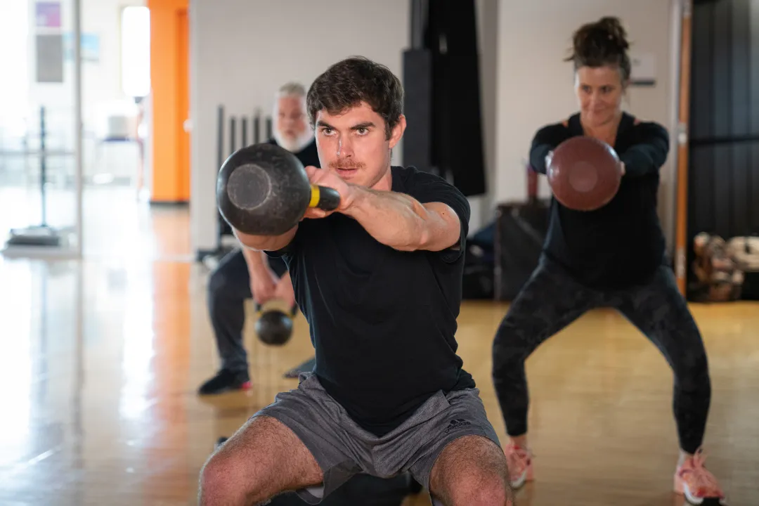 Intense Kettlebell Swing in YMCA Group Exercise Class