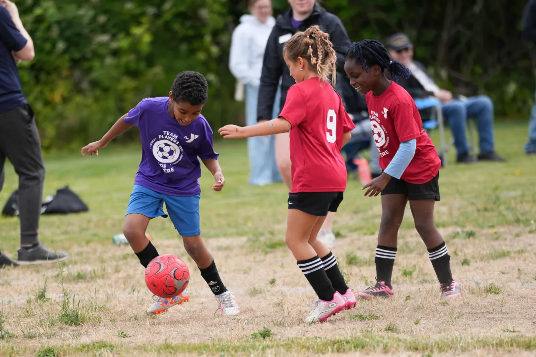 YMCA Youth Soccer League Dribbling with Defenders