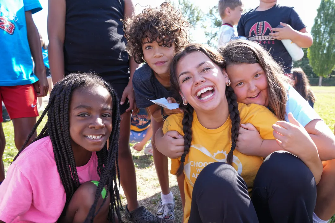 YMCA Summer Camp Counselor Posing with Campers