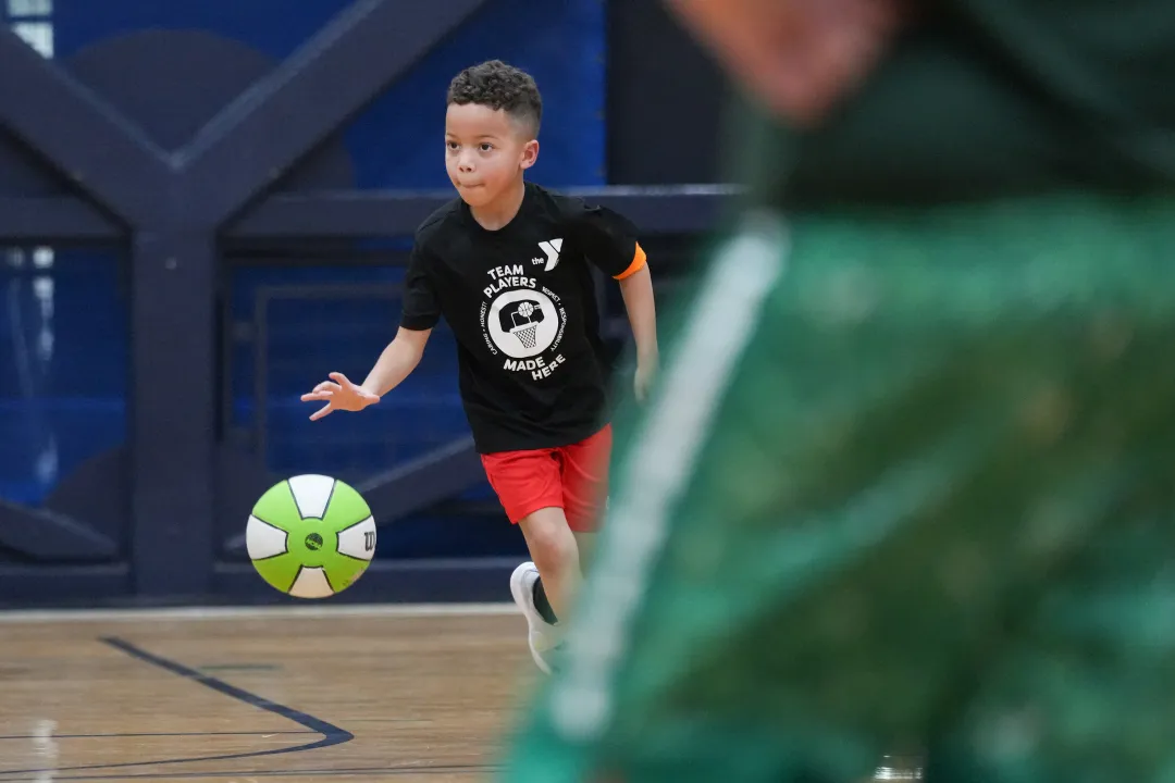 Dribbling Down the Court with Green Basketball
