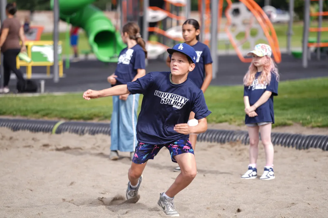 Boy Going for the Ball at YMCA UP Sports Volleyball Game